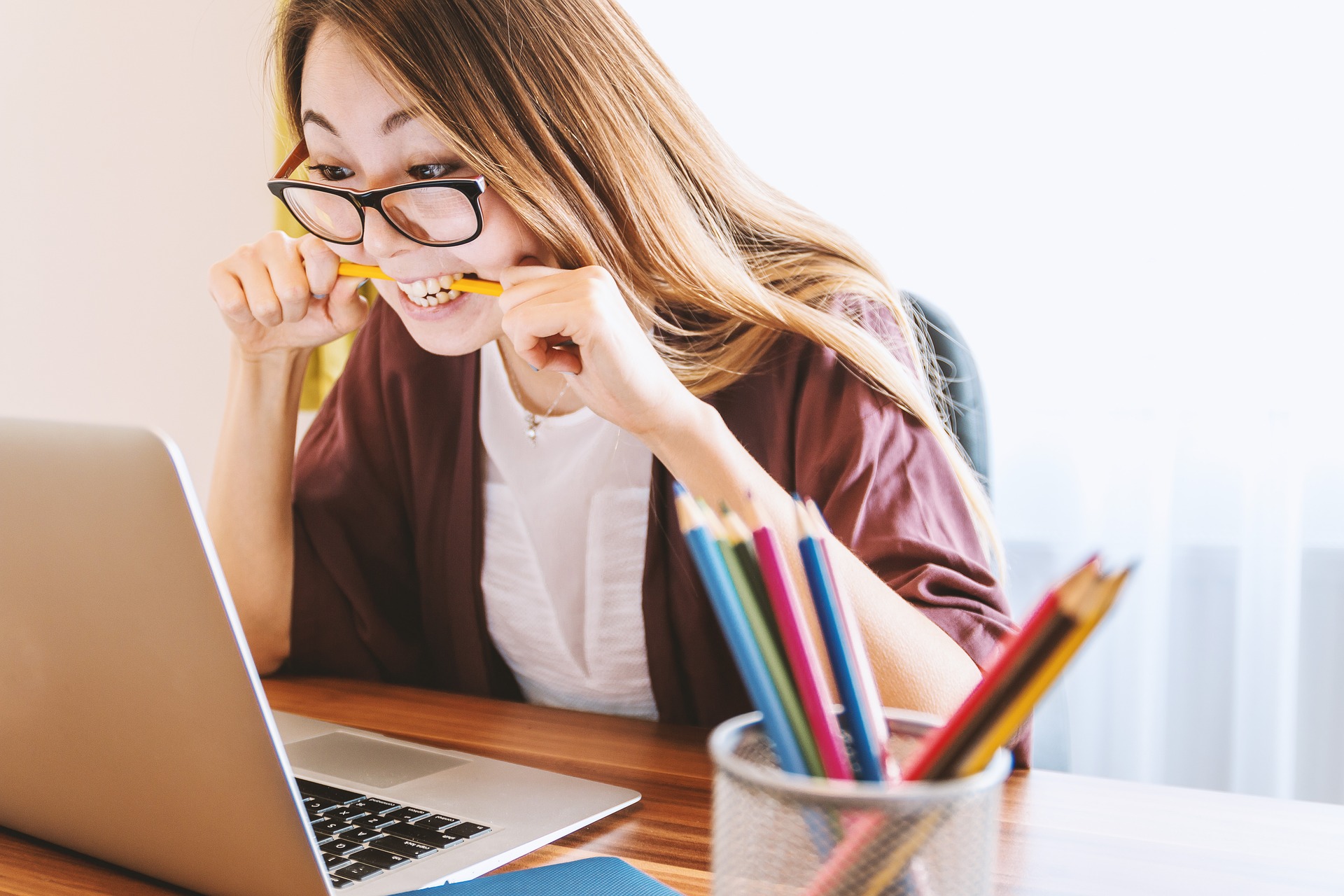 Young woman studying on laptop
