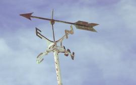 photo of a windvane with compass directions N, S, E, W