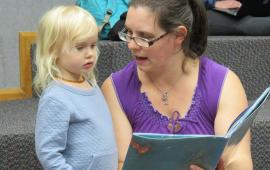 Woman reading to child