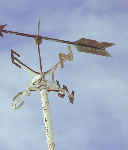 photo of a windvane with compass directions N, S, E, W