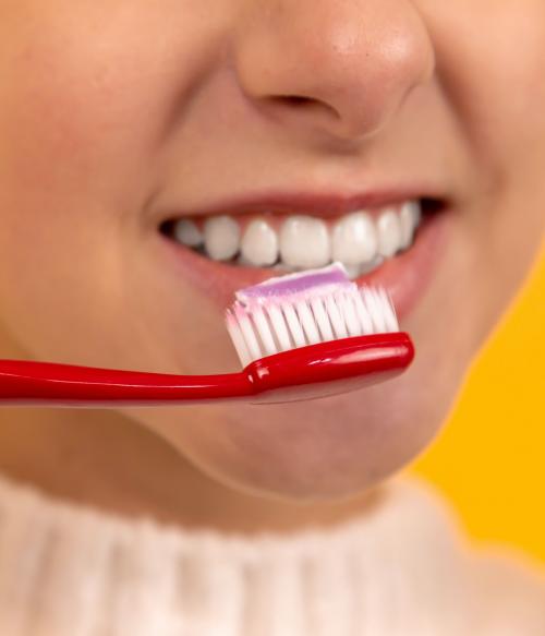 Girl brushing her teeth 