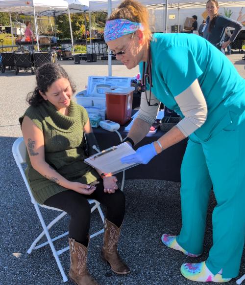 Woman getting her blood pressure checked.