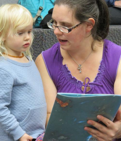 Woman reading to child