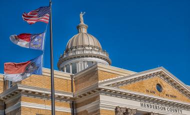Henderson County Historic Courthouse with flags